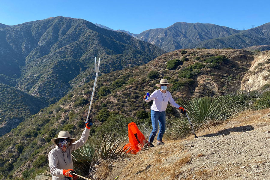 Valerie and friend in Angeles National Forest with pickers, picking up trash