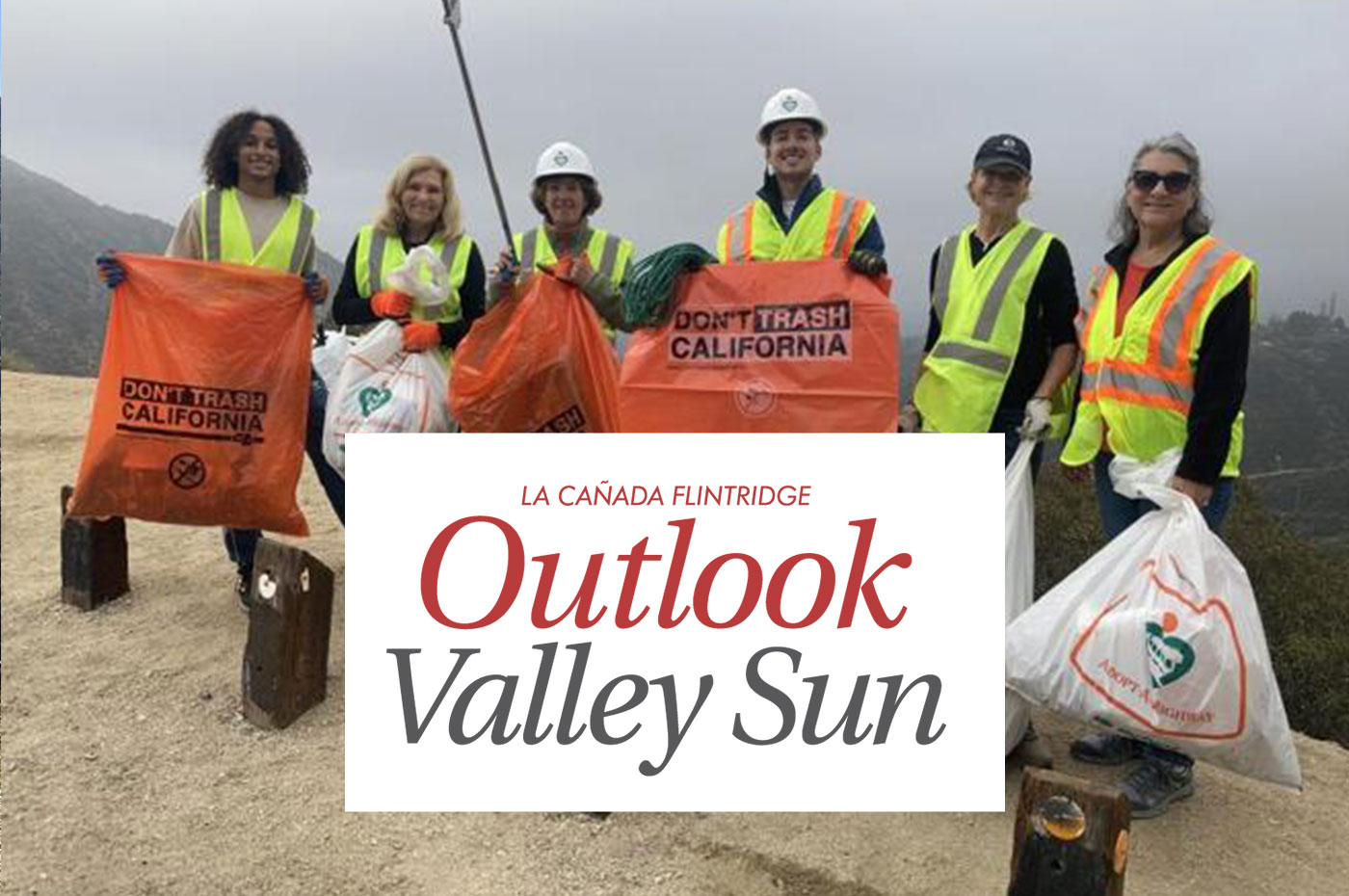 Takataka volunteer group members and Logo: Outlook valley sun